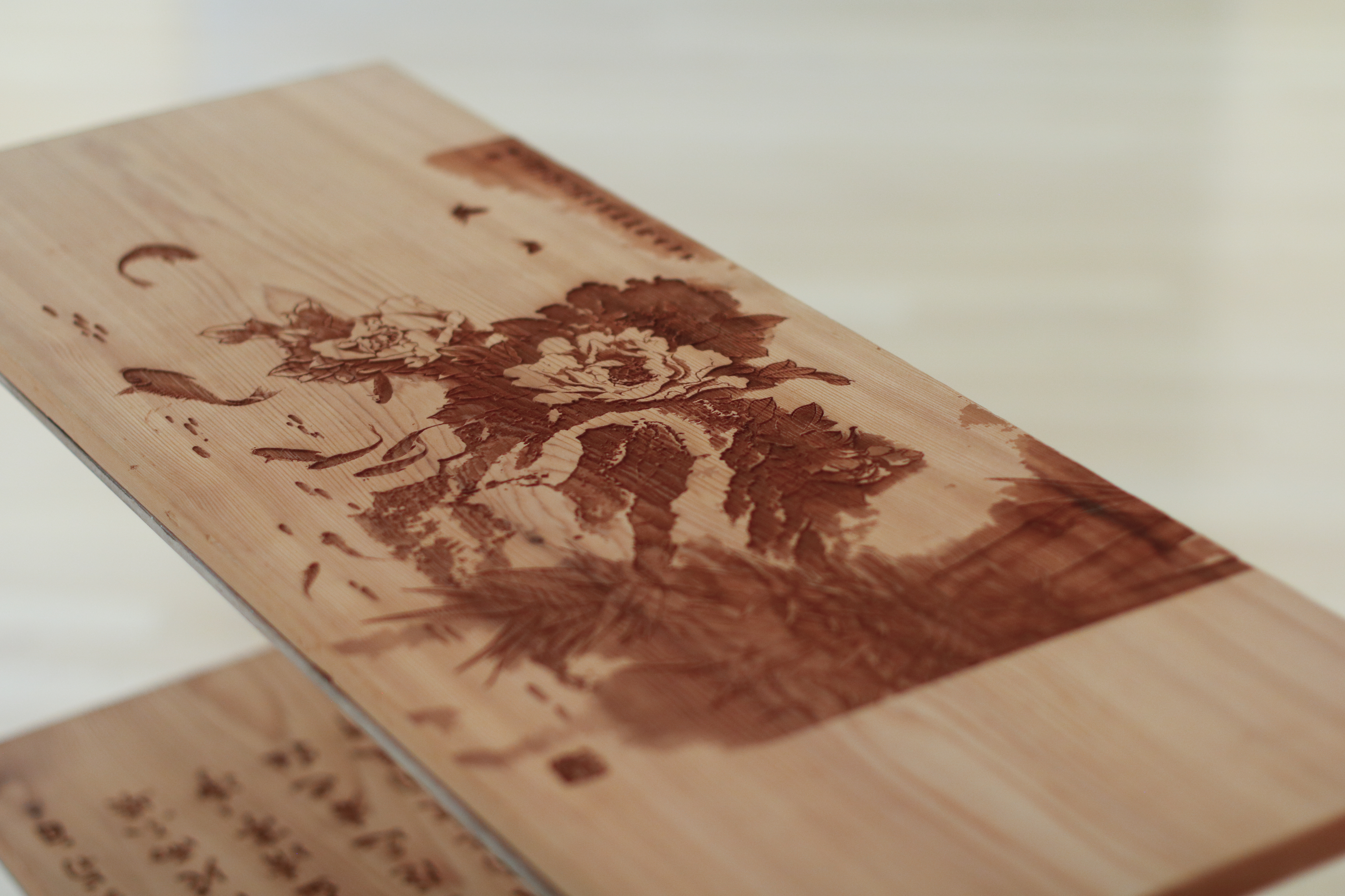 Close up details of top shelf Chinese painting engraving.